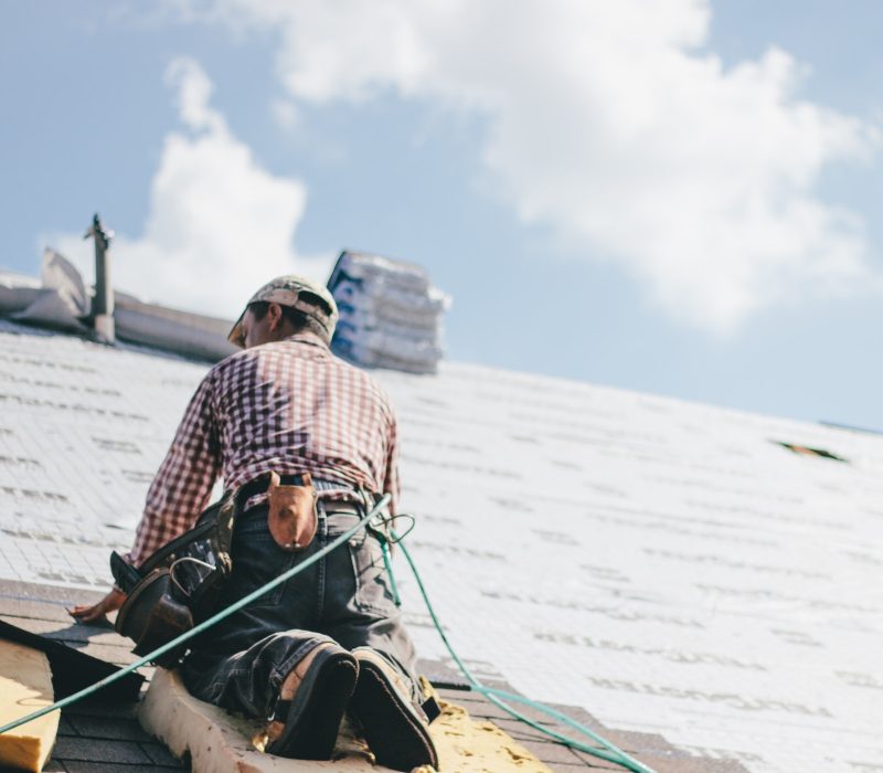 roofer-adding-shingles-to-the-roof-of-a-house.jpg